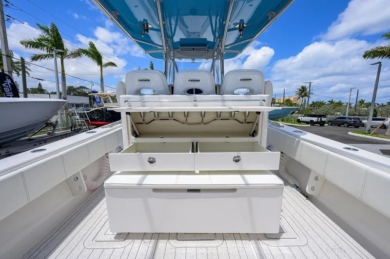 Slide: The Image of 2022 Contender 35 ST boat interior with open storage compartments, showcasing sleek design and functionality. - 43