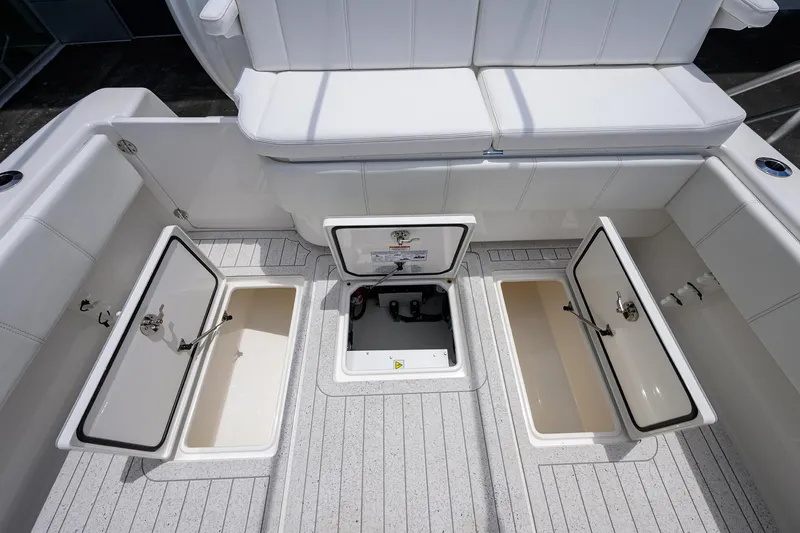 Slide: The Image of 2022 Contender 35 ST boat with open storage compartments and seating area. - 45