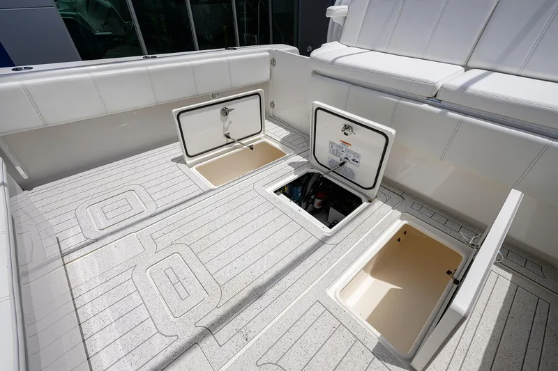 Slide: The Image of 2022 Contender 35 ST boat deck with open storage compartments. - 46
