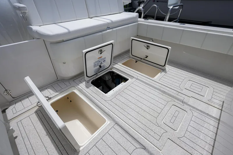 Slide: The Image of 2022 Contender 35 ST boat deck with open storage compartments. - 47