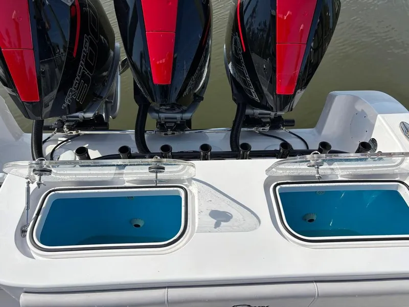 Slide: The Image of 2024 Fountain 34 TE boat with triple outboard engines and dual livewells. - 5