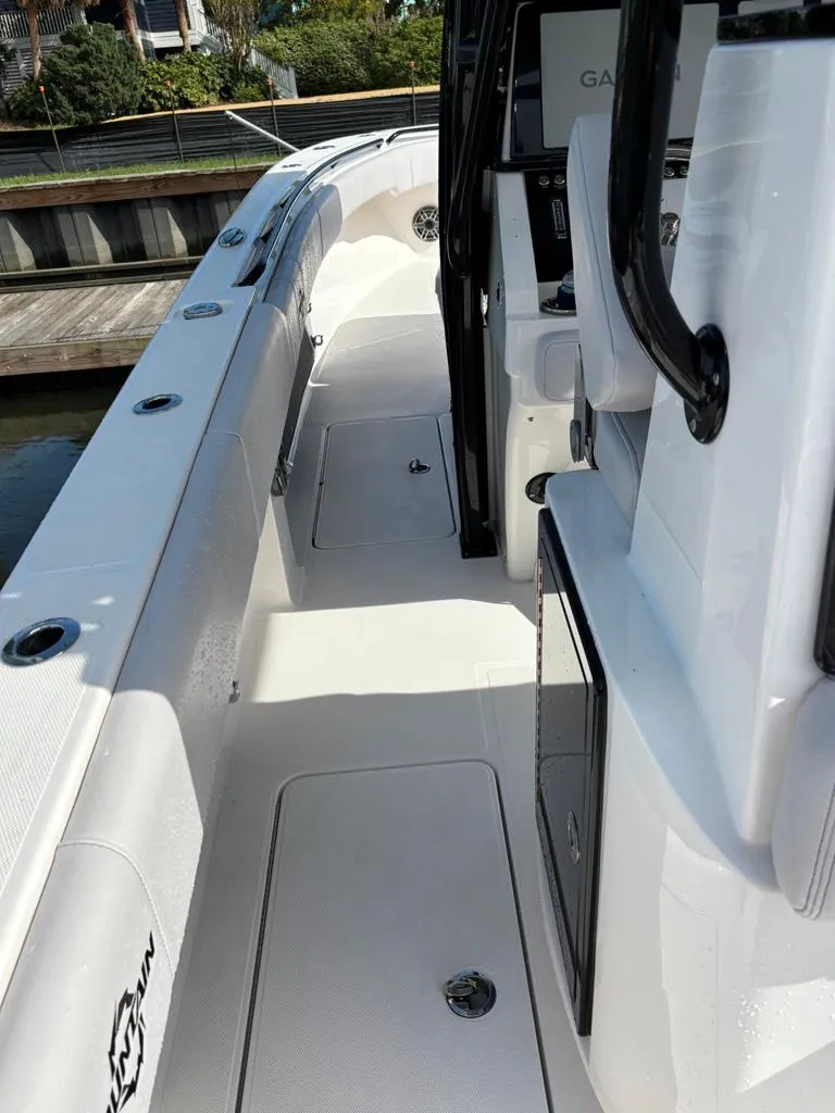 Slide: The Image of 2024 Fountain 34 TE boat deck, featuring sleek design and modern amenities. - 7