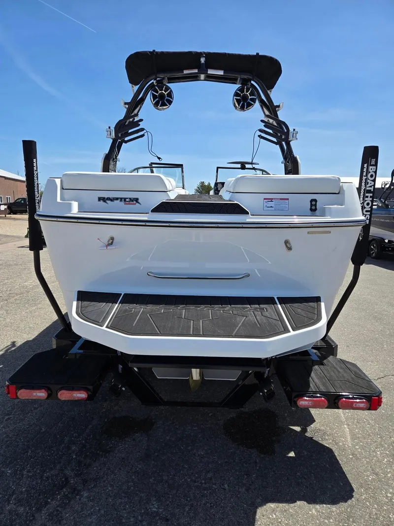 Slide: The Image of 2025 Moomba Craz boat rear view with Raptor engine, on a sunny day. - 14