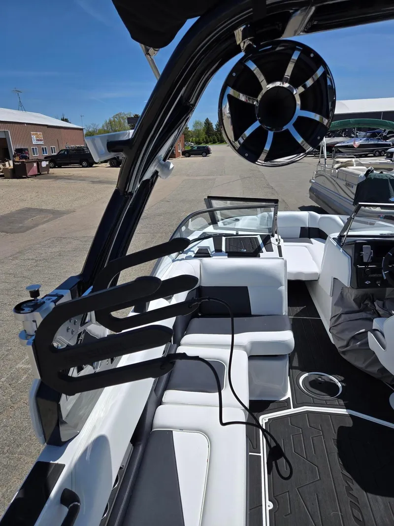 Slide: The Image of 2025 Moomba Craz boat interior with sleek seating and modern audio system. - 21