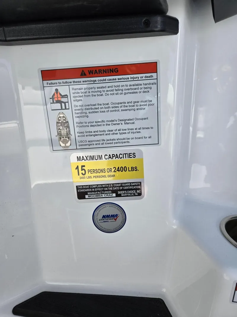 Slide: The Image of 2025 Moomba Craz boat warning label showing maximum capacity of 15 persons or 2400 lbs. - 26