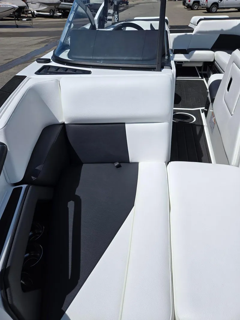 Slide: The Image of 2025 Moomba Craz boat interior with white and black seating, modern design. - 7