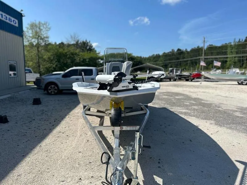 Slide: The Image of 2025 Xpress H20B boat on trailer in outdoor lot, clear sky background. - 6