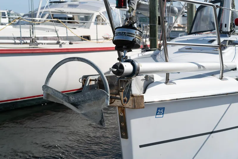 Slide: The Image of Hunter 36 sailboat bow with anchor, 2004 model, docked in marina. - 16