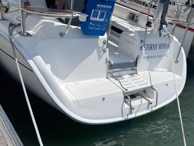 Slide: The Image of Hunter 36 sailboat, 2004 model, docked at Wrightsville Beach, NC, with swim platform. - 2