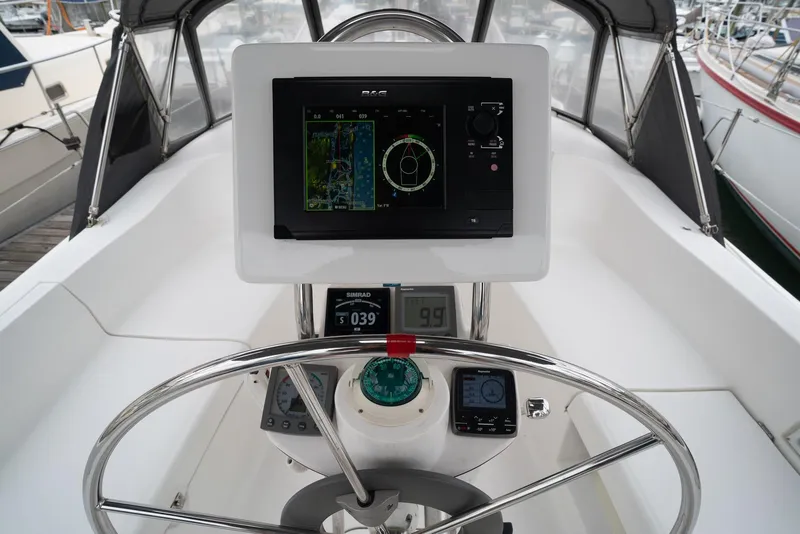 Slide: The Image of Steering console of a 2004 Hunter 36 sailboat with navigation equipment. - 9