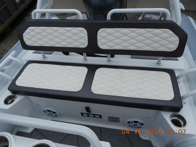 Slide: The Image of 2025 Highfield Sport 560 boat seating with quilted upholstery and integrated speakers. - 13