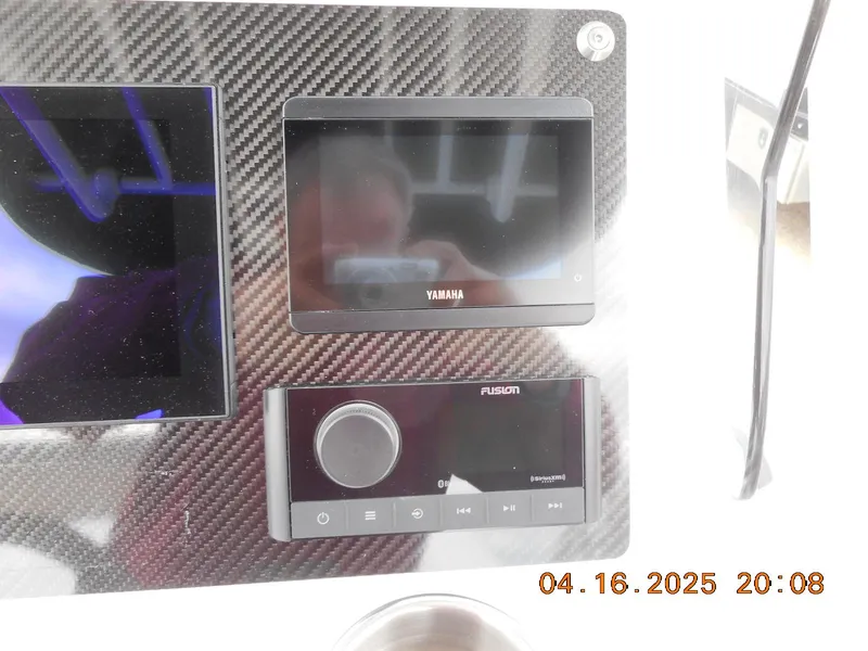 Slide: The Image of Control panel of 2025 Highfield Sport 560 with Yamaha and Fusion displays. - 16