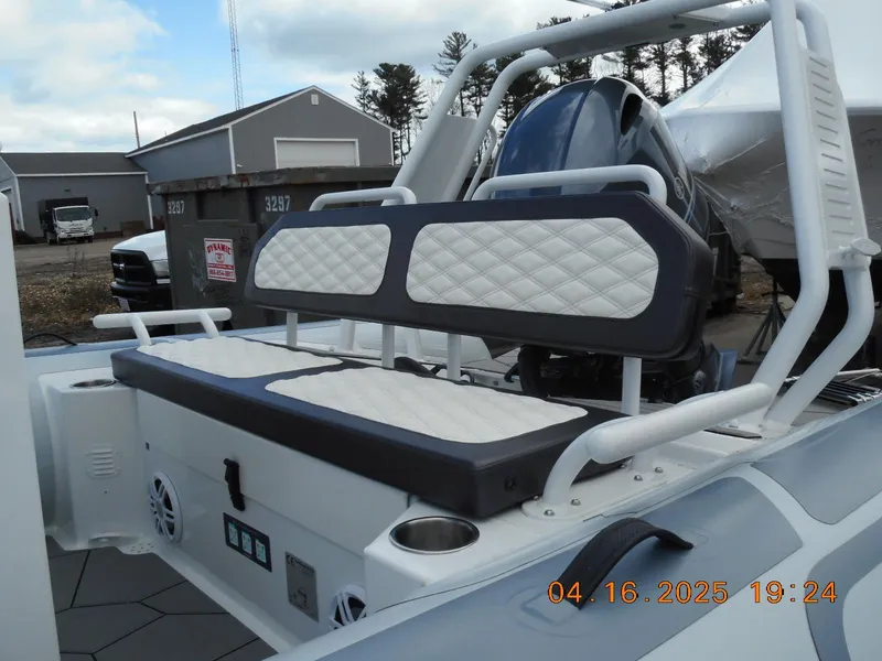 Slide: The Image of Highfield Sport 560 boat interior, 2025 model, featuring cushioned seating and modern design elements. - 4