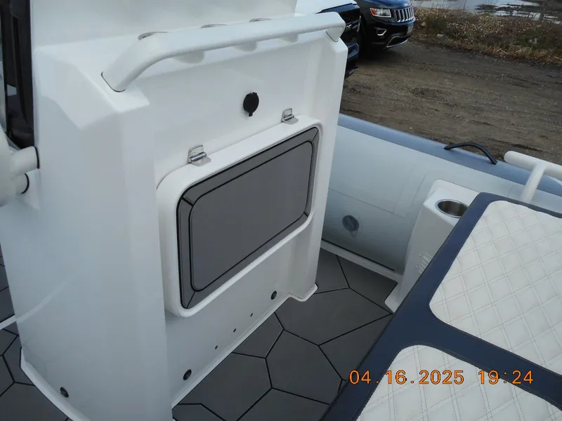 Slide: The Image of 2025 Highfield Sport 560 boat interior with storage compartment and seating. - 7
