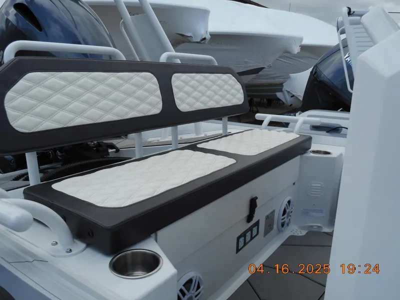 Slide: The Image of 2025 Highfield Sport 560 boat interior with cushioned seating and cup holders. - 8