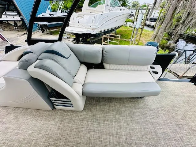 Slide: The Image of Luxurious seating on 2019 Harris 270 Grand Mariner pontoon boat, featuring plush gray upholstery. - 11