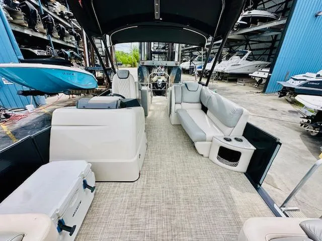 Slide: The Image of 2019 Harris 270 Grand Mariner pontoon boat interior with spacious seating and modern design. - 16