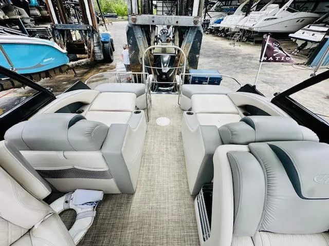 Slide: The Image of 2019 Harris 270 Grand Mariner pontoon boat interior with plush seating and modern design. - 5