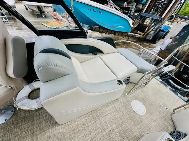 Slide: The Image of 2019 Harris 270 Grand Mariner boat interior with plush seating and modern design. - 7