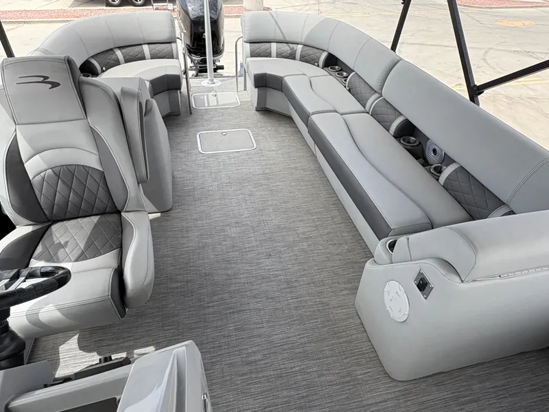 Slide: The Image of 2021 Bennington 25 LFBC pontoon boat interior with luxurious gray seating and modern design. - 6