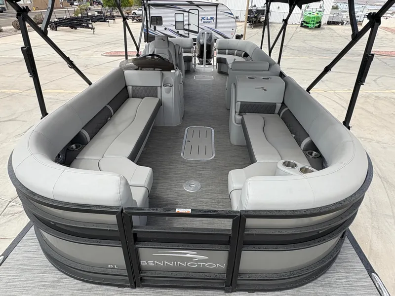 Slide: The Image of 2021 Bennington 25 LFBC pontoon boat with spacious seating and modern design. - 7