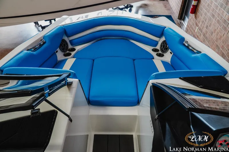 Slide: The Image of 2019 Axis A24 boat interior with blue seating at Lake Norman Marina. - 15