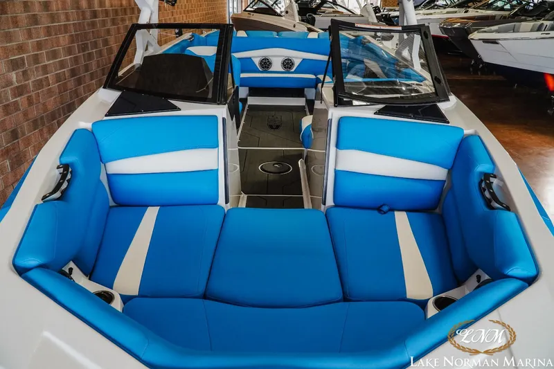 Slide: The Image of 2019 Axis A24 boat interior with blue and white seating at Lake Norman Marina. - 16