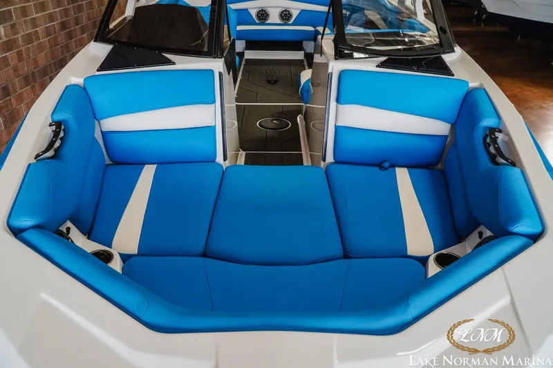 Slide: The Image of 2019 Axis A24 boat interior with blue and white seating at Lake Norman Marina. - 17