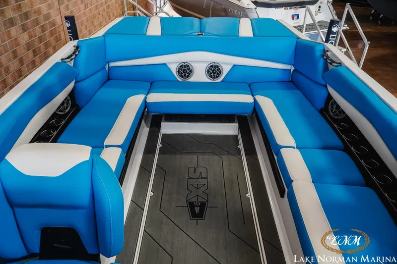 Slide: The Image of 2019 Axis A24 boat interior with blue and white seating at Lake Norman Marina. - 19