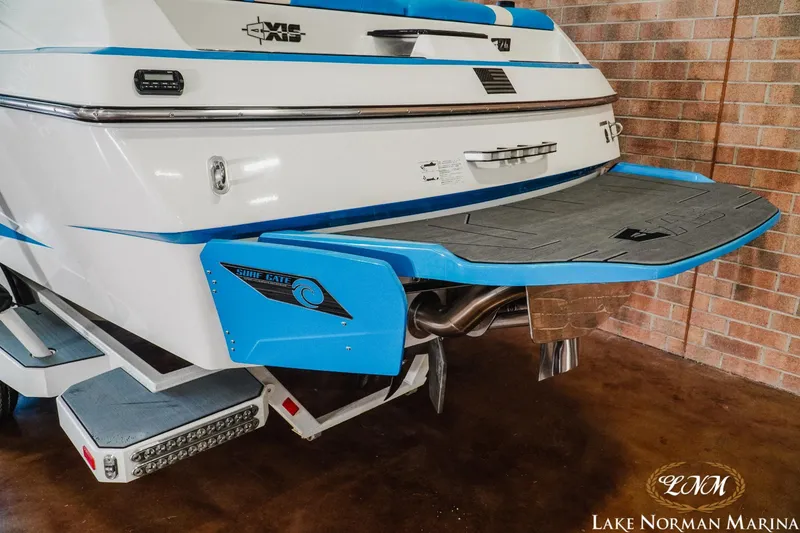Slide: The Image of 2019 Axis A24 boat with Surf Gate, displayed at Lake Norman Marina. - 6