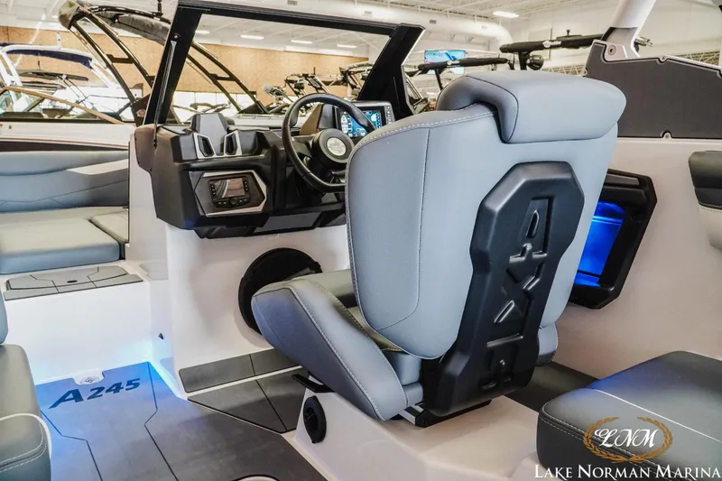 Slide: The Image of 2024 Axis A245 boat interior with modern helm and seating at Lake Norman Marina. - 10