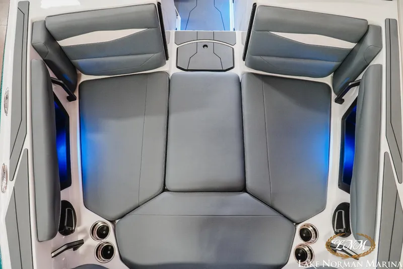 Slide: The Image of 2024 Axis A245 boat interior with gray seating and blue LED lighting. - 13