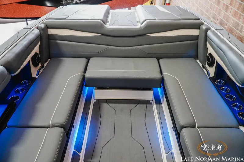 Slide: The Image of Luxurious interior of 2024 Axis A245 boat with gray seating and blue LED lighting. - 15