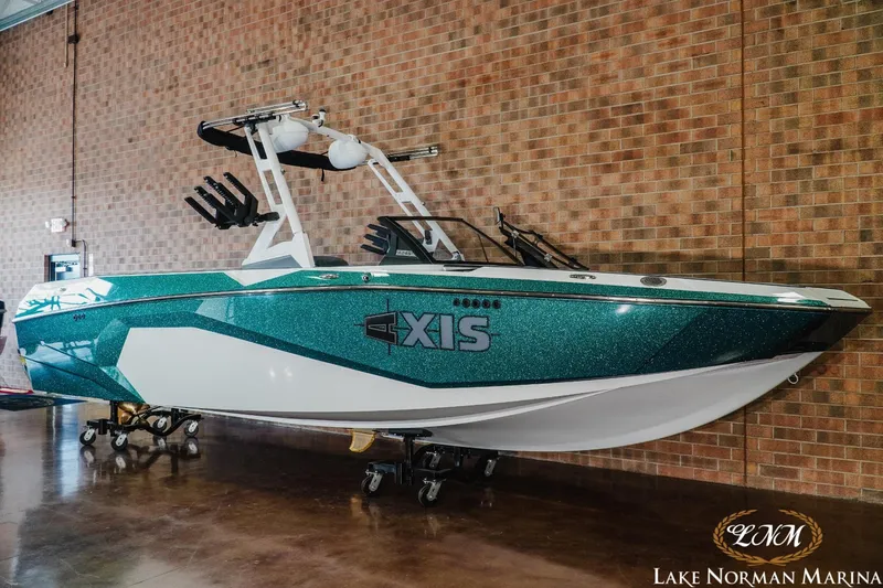 Slide: The Image of 2024 Axis A245 boat displayed indoors at Lake Norman Marina. - 3