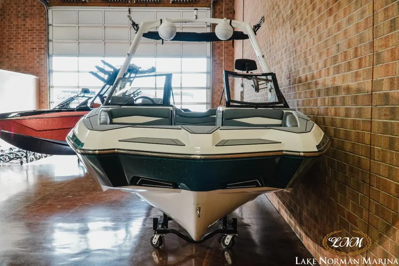 Slide: The Image of 2024 Axis A245 boat displayed at Lake Norman Marina showroom. - 4