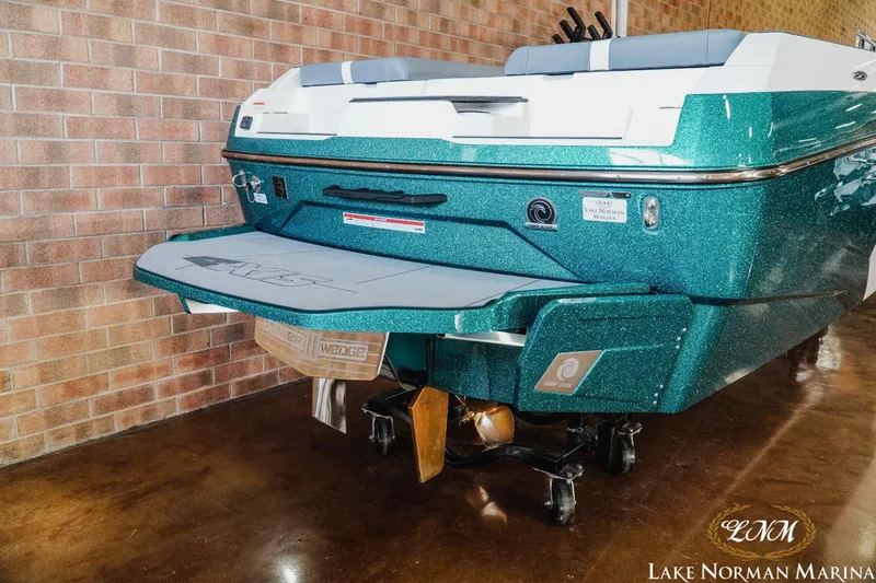 Slide: The Image of 2024 Axis A245 boat with teal finish at Lake Norman Marina. - 6