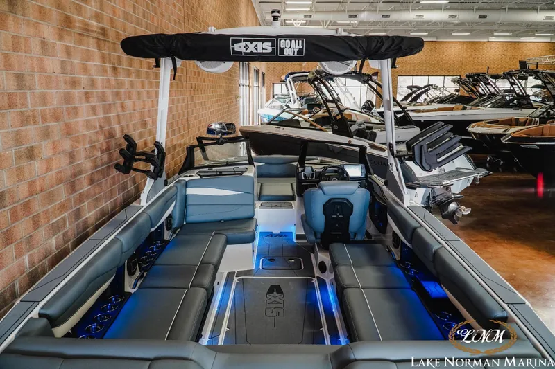 Slide: The Image of 2024 Axis A245 boat interior with blue LED lighting at Lake Norman Marina. - 7