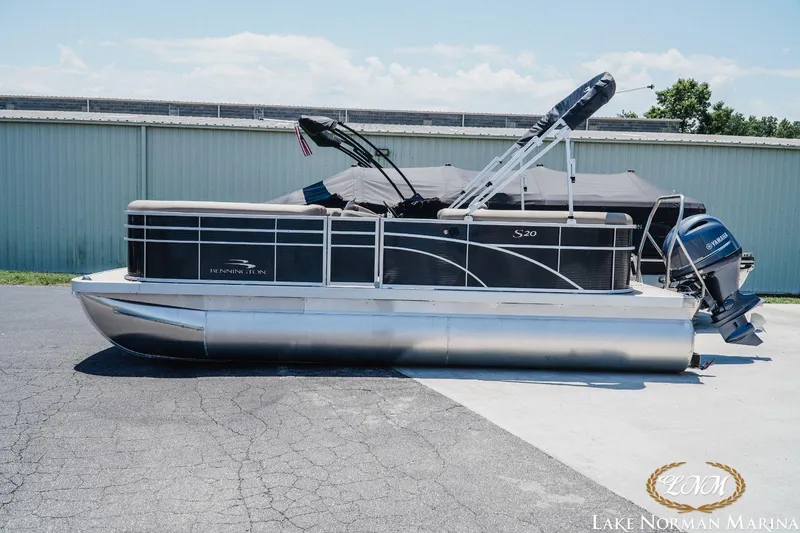 Slide: The Image of 2024 Bennington 20SSR pontoon boat with Yamaha outboard motor at Lake Norman Marina. - 1