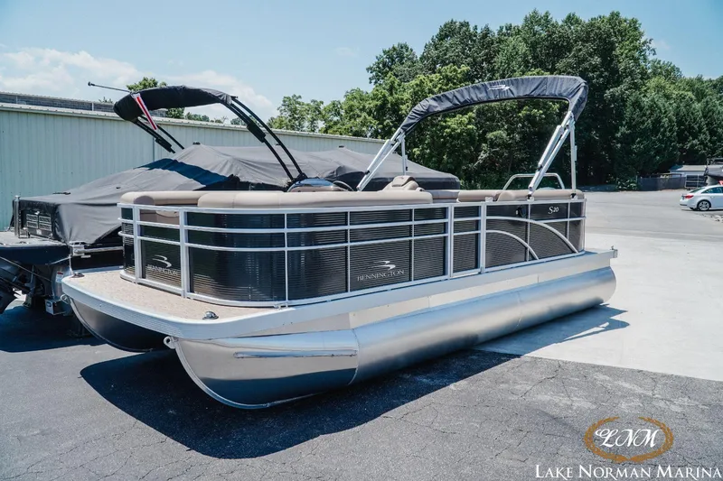 Slide: The Image of 2024 Bennington 20SSR pontoon boat at Lake Norman Marina, featuring sleek design and canopy. - 3