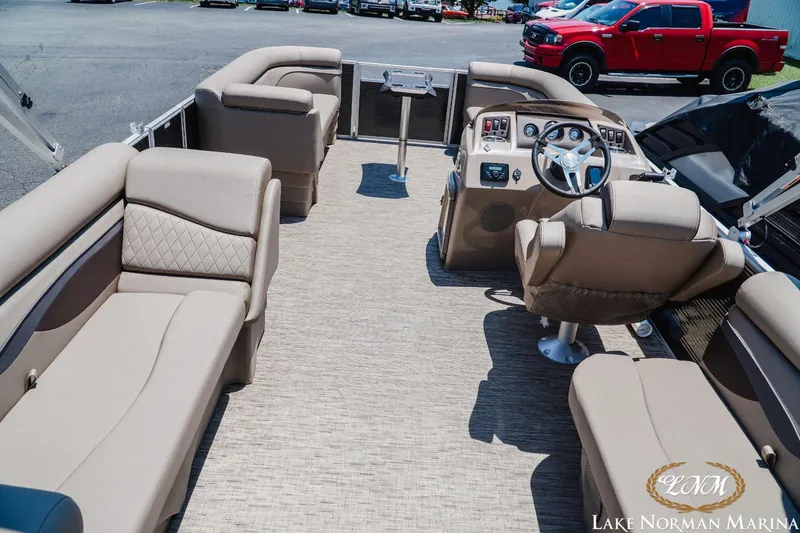 Slide: The Image of 2024 Bennington 20SSR pontoon boat interior with luxurious seating and modern helm. - 4