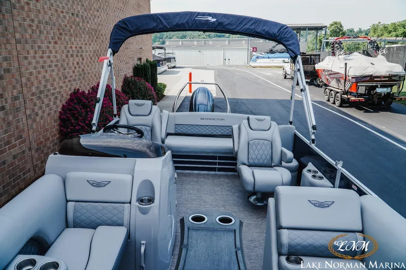 Slide: The Image of 2025 Bennington 22LSB pontoon boat with luxurious seating at Lake Norman Marina. - 11