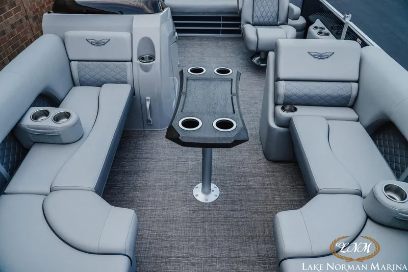 Slide: The Image of Luxurious interior of 2025 Bennington 22LSB pontoon boat with plush seating and cup holders. - 12
