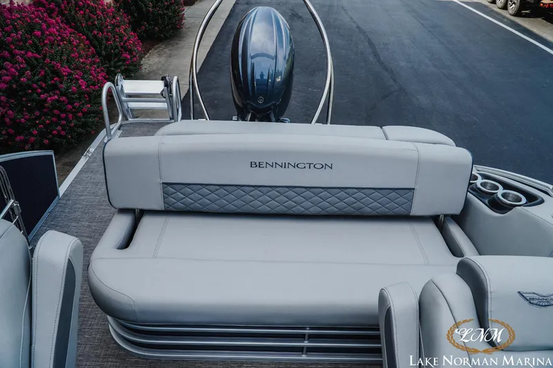 Slide: The Image of 2025 Bennington 22LSB boat interior with plush seating at Lake Norman Marina. - 15