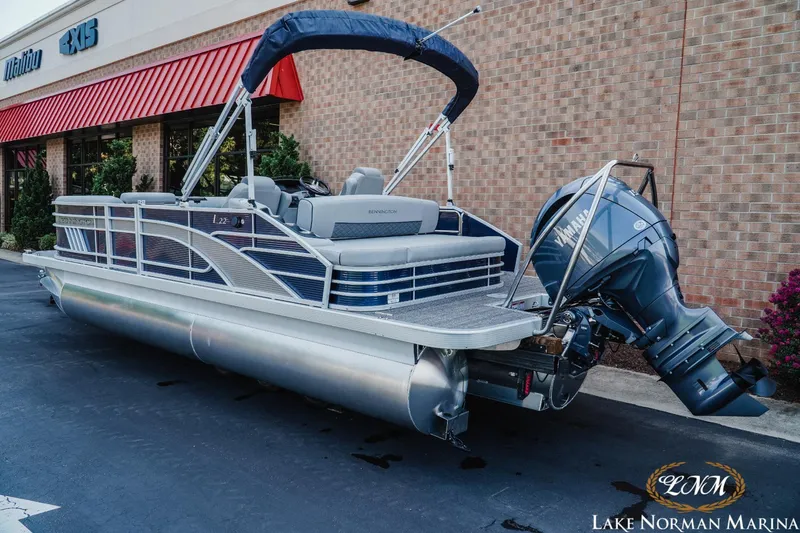 Slide: The Image of 2025 Bennington 22LSB pontoon boat with Yamaha engine at Lake Norman Marina. - 2