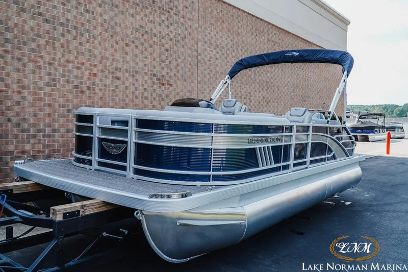 Slide: The Image of 2025 Bennington 22LSB pontoon boat at Lake Norman Marina, featuring sleek design and modern amenities. - 3