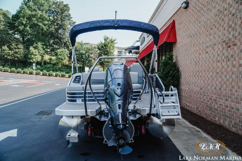 Slide: The Image of 2025 Bennington 22LSB pontoon boat with outboard motor at Lake Norman Marina. - 4