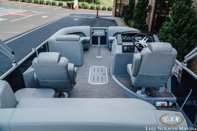 Slide: The Image of 2025 Bennington 22LSB pontoon boat interior with plush seating and modern helm. - 5
