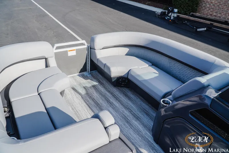 Slide: The Image of 2025 Bennington 22MFB pontoon boat interior with luxurious seating and modern design. - 13