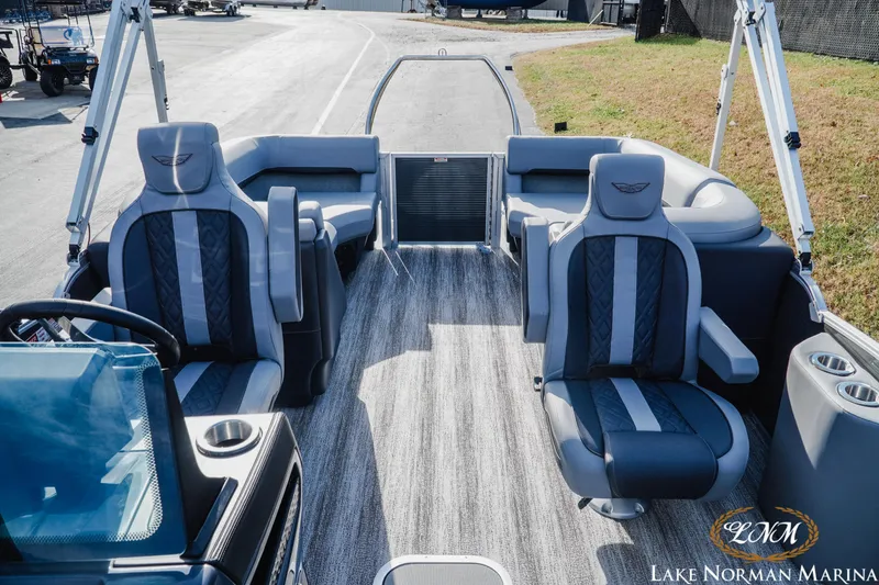 Slide: The Image of 2025 Bennington 22MFB pontoon boat interior with luxury seating at Lake Norman Marina. - 6
