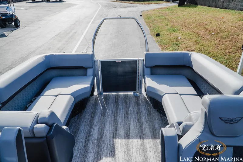 Slide: The Image of 2025 Bennington 22MFB pontoon boat interior with gray seating at Lake Norman Marina. - 7